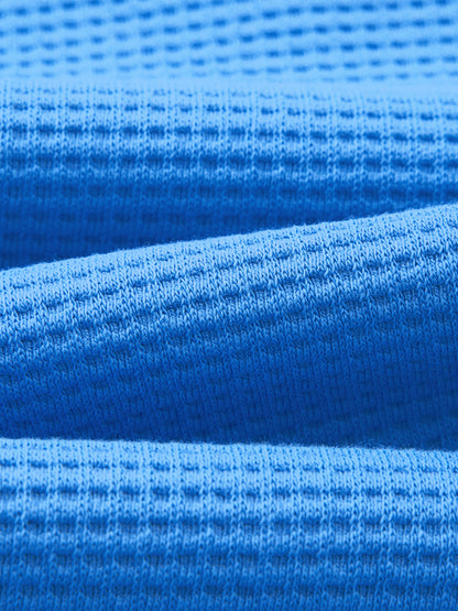 Close-up of the blue waffle knit fabric texture of the boxy t-shirt