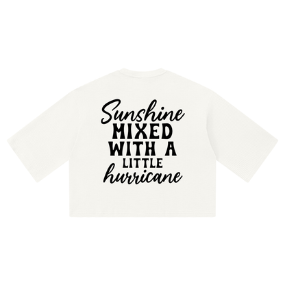 White waffle knit boxy t-shirt with black cursive and bold capital Sunshine mixed with a little hurricane lettering on the back