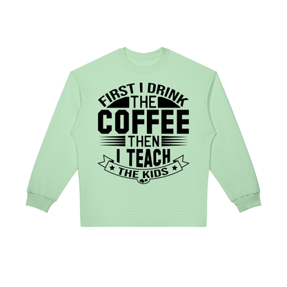 Light Green oversized crewneck sweatshirt with black First I drink the coffee then I teach the kids lettering with a star ribbon banner on the front