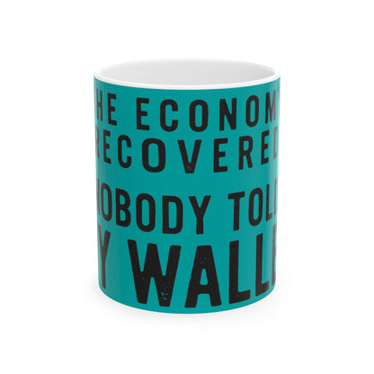 Funny coffee mug printed with "THE ECONOMY RECOVERED NOBODY TOLD MY WALLET", front view