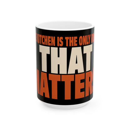 Funny coffee mug printed with "THE KITCHEN IS THE ONLY ROOM THAT MATTERS", three-quarter view with the handle on the right