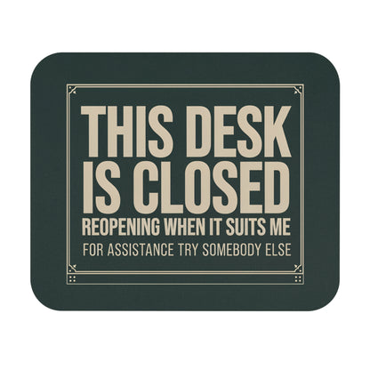 Funny this desk is closed mouse pad styled like a store sign, flat front view