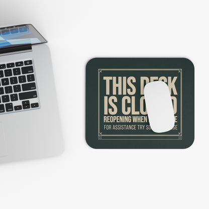 Top view of the this desk is closed mouse pad beside a laptop keyboard