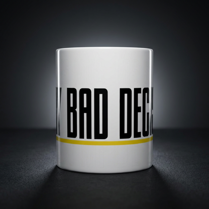 Funny coffee mug printed with "THIS MUG HAS SEEN / EVERY BAD DECISION", shown on a dark studio background