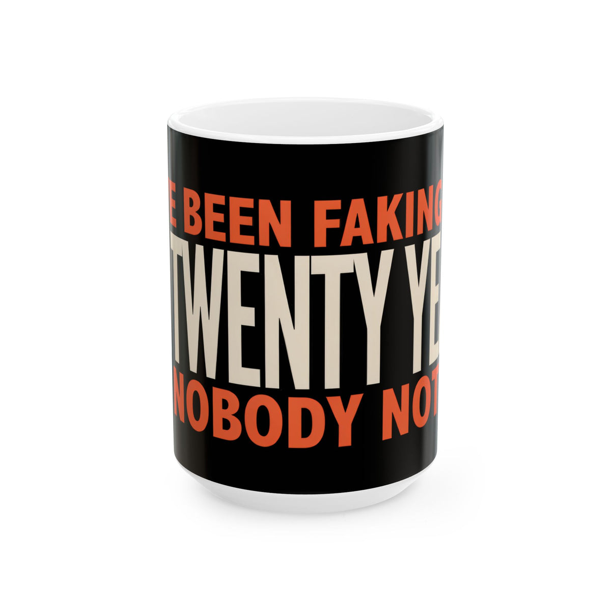 Funny coffee mug printed with "I HAVE BEEN FAKING THIS FOR TWENTY YEARS AND NOBODY NOTICED", back view showing the handle