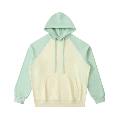 Unisex Color-Block Raglan Sleeve Hoodie in mild apricot with green