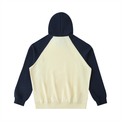 Unisex Color-Block Raglan Sleeve Hoodie in mild apricot with navy blue, alternate angle