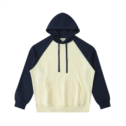Unisex Color-Block Raglan Sleeve Hoodie in mild apricot with navy blue
