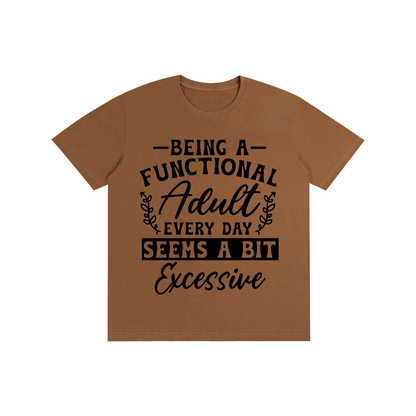 Brown unisex t-shirt with a bold and cursive funny adulting quote printed across the chest