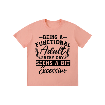 Peach unisex t-shirt with a bold and cursive funny adulting quote printed across the chest