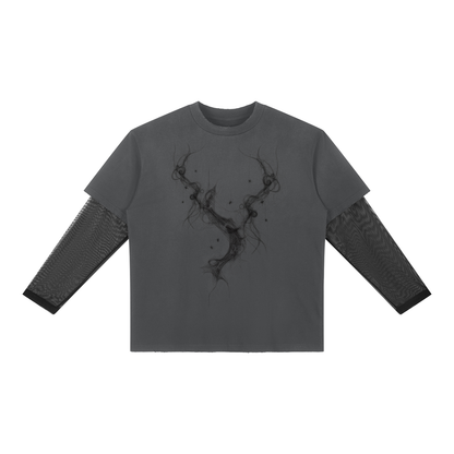 Front of dark gray layered long sleeve tee with sheer mesh sleeves and a smoky abstract branch graphic down the chest