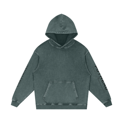 Dark green snow wash oversized hoodie with a kangaroo pocket and sleeve lettering, front view