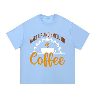 Blue oversized cotton t-shirt with a rust brown Wake up and smell the coffee design with a white coffee cup and orange cursive Coffee on the front