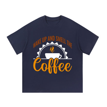 Navy Blue oversized cotton t-shirt with a rust brown Wake up and smell the coffee design with a white coffee cup and orange cursive Coffee on the front