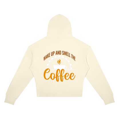 Apricot women's cropped drop shoulder hoodie with a rust brown Wake up and smell the coffee design with a white coffee cup and orange cursive Coffee on the back