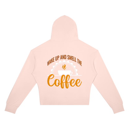Light Pink women's cropped drop shoulder hoodie with a rust brown Wake up and smell the coffee design with a white coffee cup and orange cursive Coffee on the back
