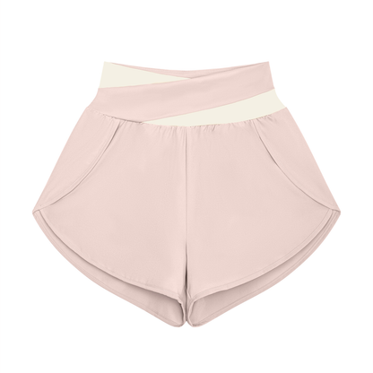 Women's Cross-Over Paneled Yoga Shorts in light pink with apricot