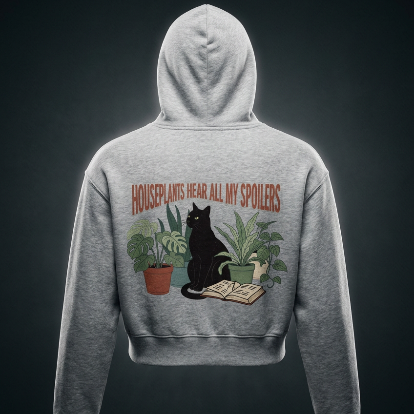 Women’s cropped drop-shoulder hoodie with a black cat beside houseplants and an open book, Houseplants Hear All My Spoilers back print