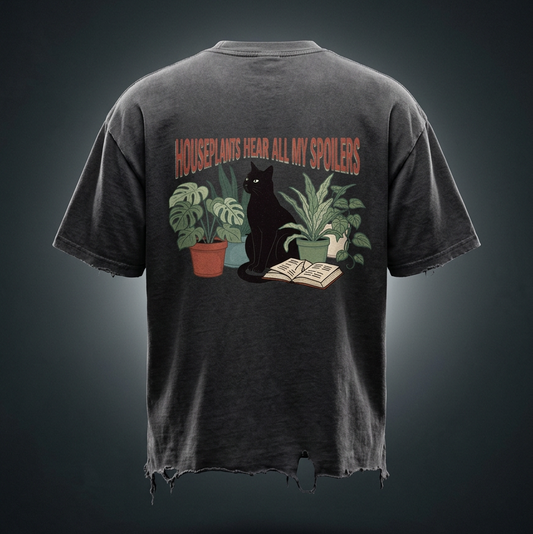 Unisex vintage-wash boxy tee with a distressed hem with a black cat beside houseplants and an open book, Houseplants Hear All My Spoilers back print