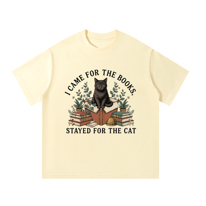 Unisex oversized heavyweight cotton tee with a black cat on a stack of books and plants, I Came for the Books, Stayed for the Cat front print
