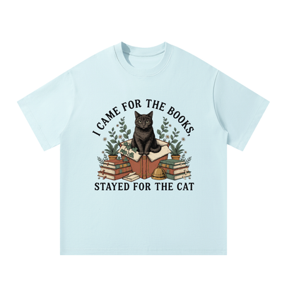 Unisex oversized heavyweight cotton tee with a black cat on a stack of books and plants, I Came for the Books, Stayed for the Cat front print