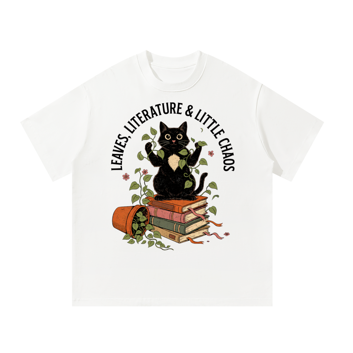 Unisex oversized heavyweight cotton tee with a black cat on books beside a tipped plant pot, Leaves, Literature & Little Chaos front print