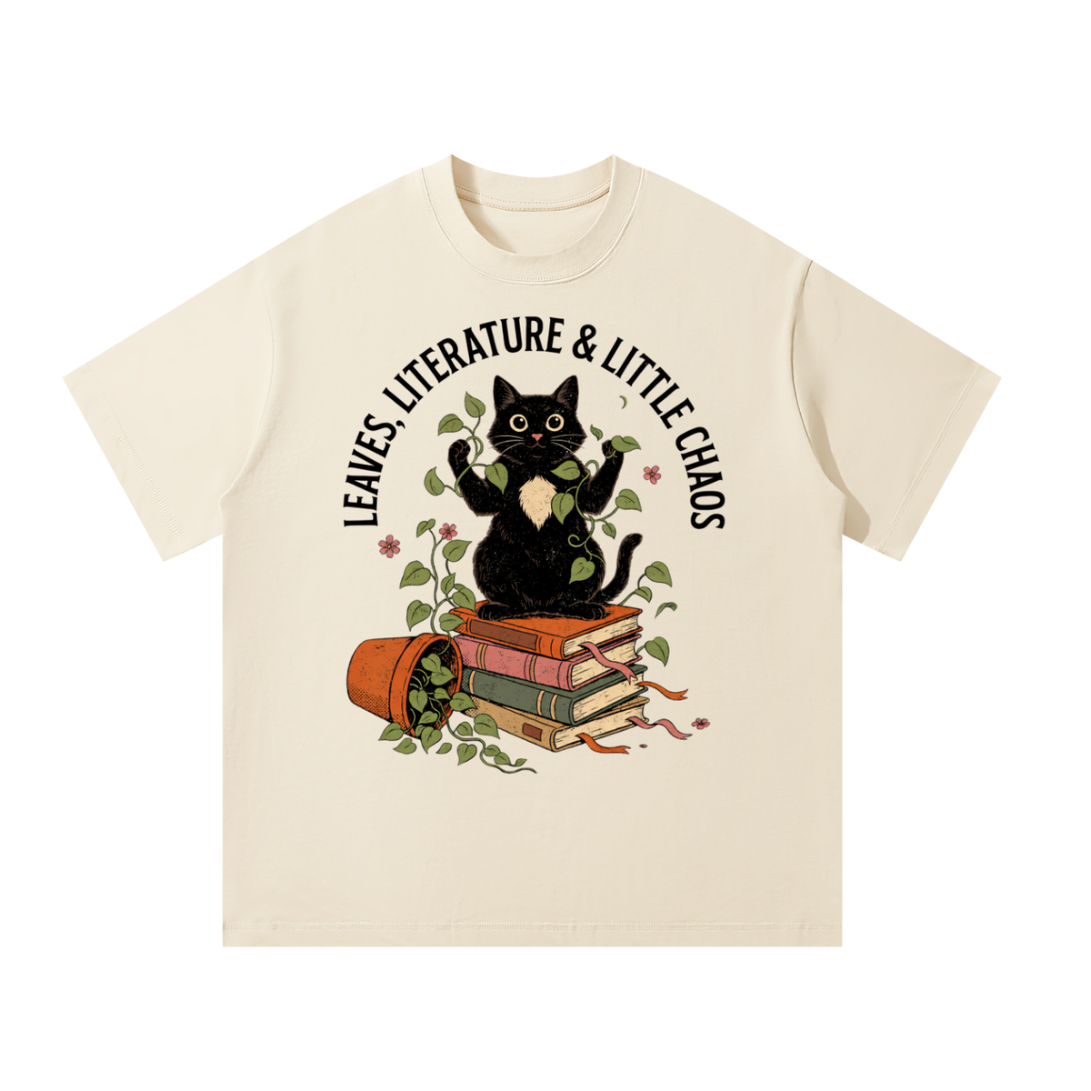 Unisex oversized heavyweight cotton tee with a black cat on books beside a tipped plant pot, Leaves, Literature & Little Chaos front print