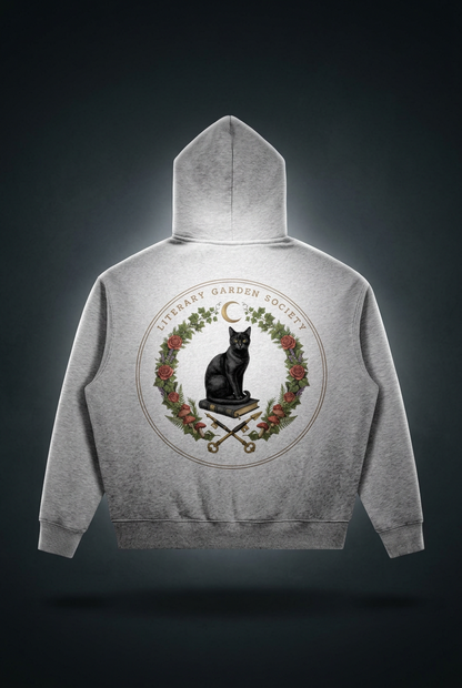 Women’s Literary Garden Society Oversized Fleece Hoodie in gray, back view with the black cat and roses crest, on a dark studio background