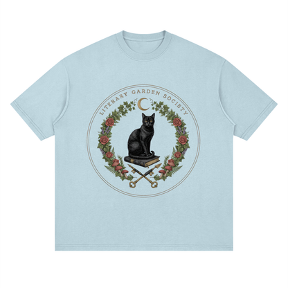 Women’s Literary Garden Society Oversized T-Shirt in pale blue with the black cat and roses crest, front print