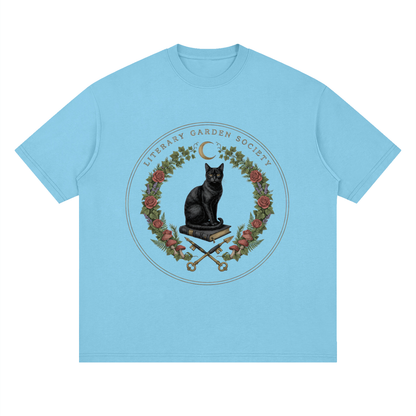 Women’s Literary Garden Society Oversized T-Shirt in sky blue with the black cat and roses crest, front print