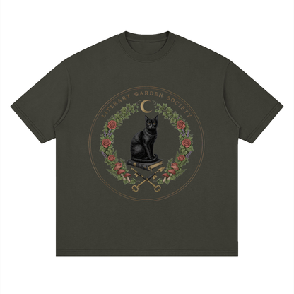 Women’s Literary Garden Society Oversized T-Shirt in dark olive with the black cat and roses crest, front print