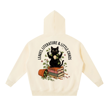 Black cat on a stack of books with vines, Leaves, Literature & Little Chaos back print on an Apricot fleece hoodie