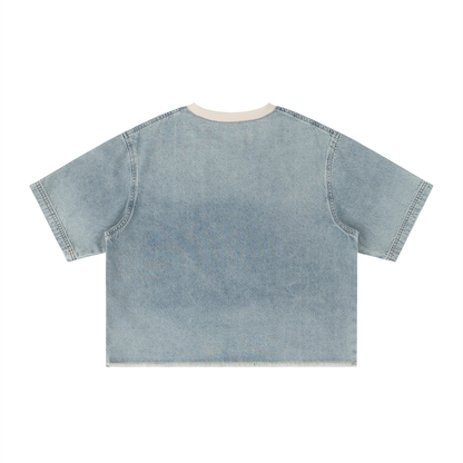 Unisex vintage-wash boxy tee with a raw hem with a sleeping black cat on an open book among flowers, Quiet Minds Grow, Wild Stories front print