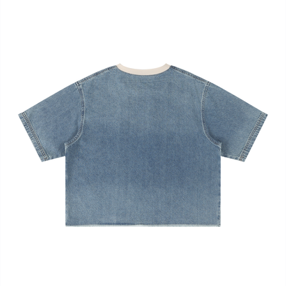 Unisex vintage-wash boxy tee with a raw hem with a sleeping black cat on an open book among flowers, Quiet Minds Grow, Wild Stories front print