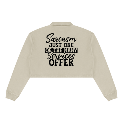 Apricot women's vintage wash cropped collared sweatshirt with black cursive and bold capital Sarcasm just one of the many services offer lettering with a black band on the back