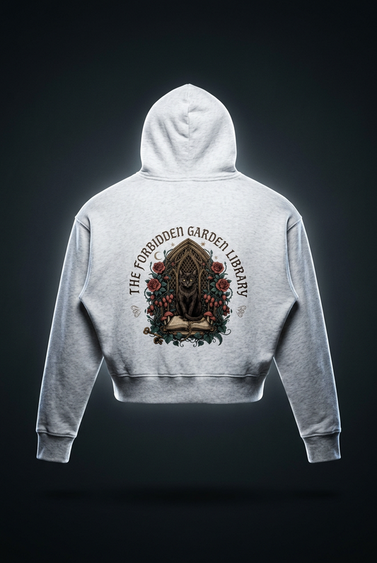 Women’s cropped drop-shoulder hoodie with a black cat in a gothic garden library doorway, The Forbidden Garden Library back print