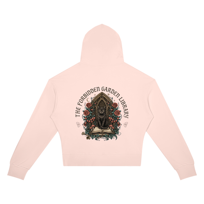 Women’s cropped drop-shoulder hoodie with a black cat in a gothic garden library doorway, The Forbidden Garden Library back print