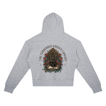 Women’s cropped drop-shoulder hoodie with a black cat in a gothic garden library doorway, The Forbidden Garden Library back print