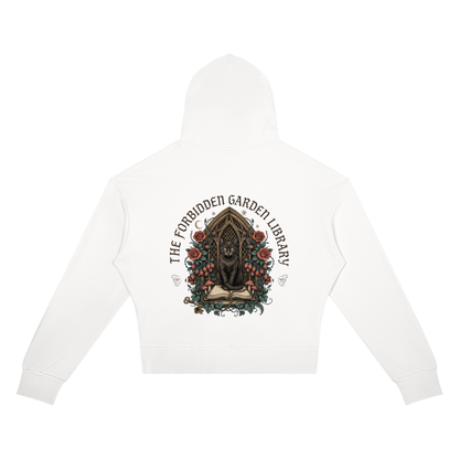 Women’s cropped drop-shoulder hoodie with a black cat in a gothic garden library doorway, The Forbidden Garden Library back print