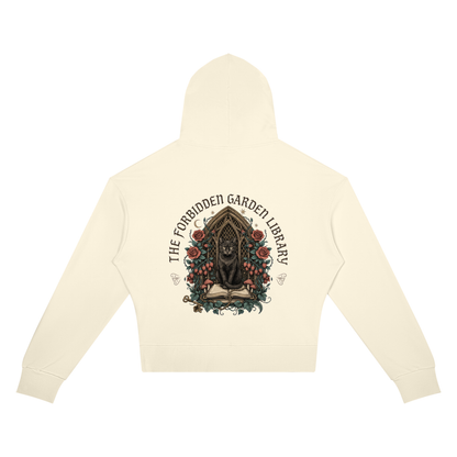 Women’s cropped drop-shoulder hoodie with a black cat in a gothic garden library doorway, The Forbidden Garden Library back print