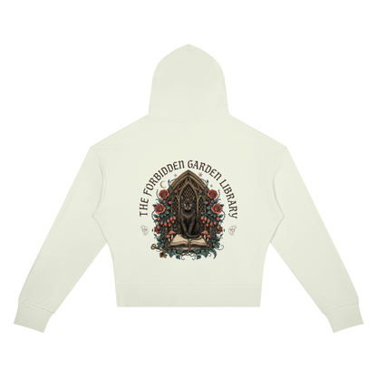 Women’s cropped drop-shoulder hoodie with a black cat in a gothic garden library doorway, The Forbidden Garden Library back print