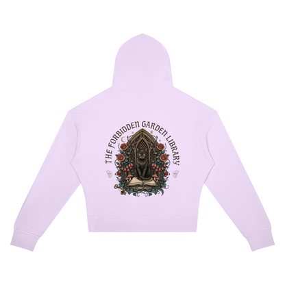 Women’s cropped drop-shoulder hoodie with a black cat in a gothic garden library doorway, The Forbidden Garden Library back print