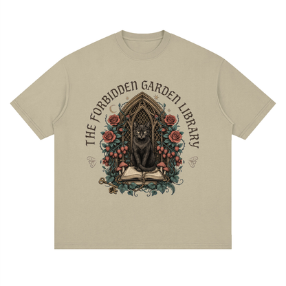 Unisex loose drop-shoulder tee with a black cat in a gothic garden library doorway, The Forbidden Garden Library front print