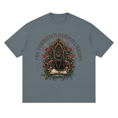 Unisex loose drop-shoulder tee with a black cat in a gothic garden library doorway, The Forbidden Garden Library front print