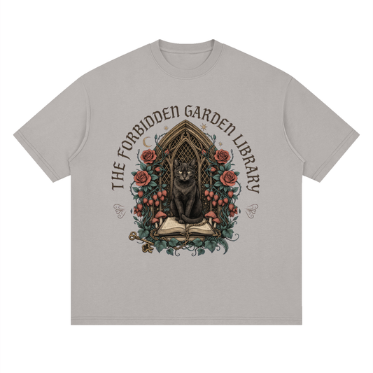 Unisex loose drop-shoulder tee with a black cat in a gothic garden library doorway, The Forbidden Garden Library front print