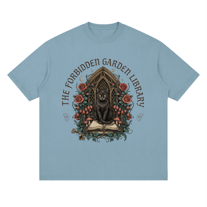 Unisex loose drop-shoulder tee with a black cat in a gothic garden library doorway, The Forbidden Garden Library front print