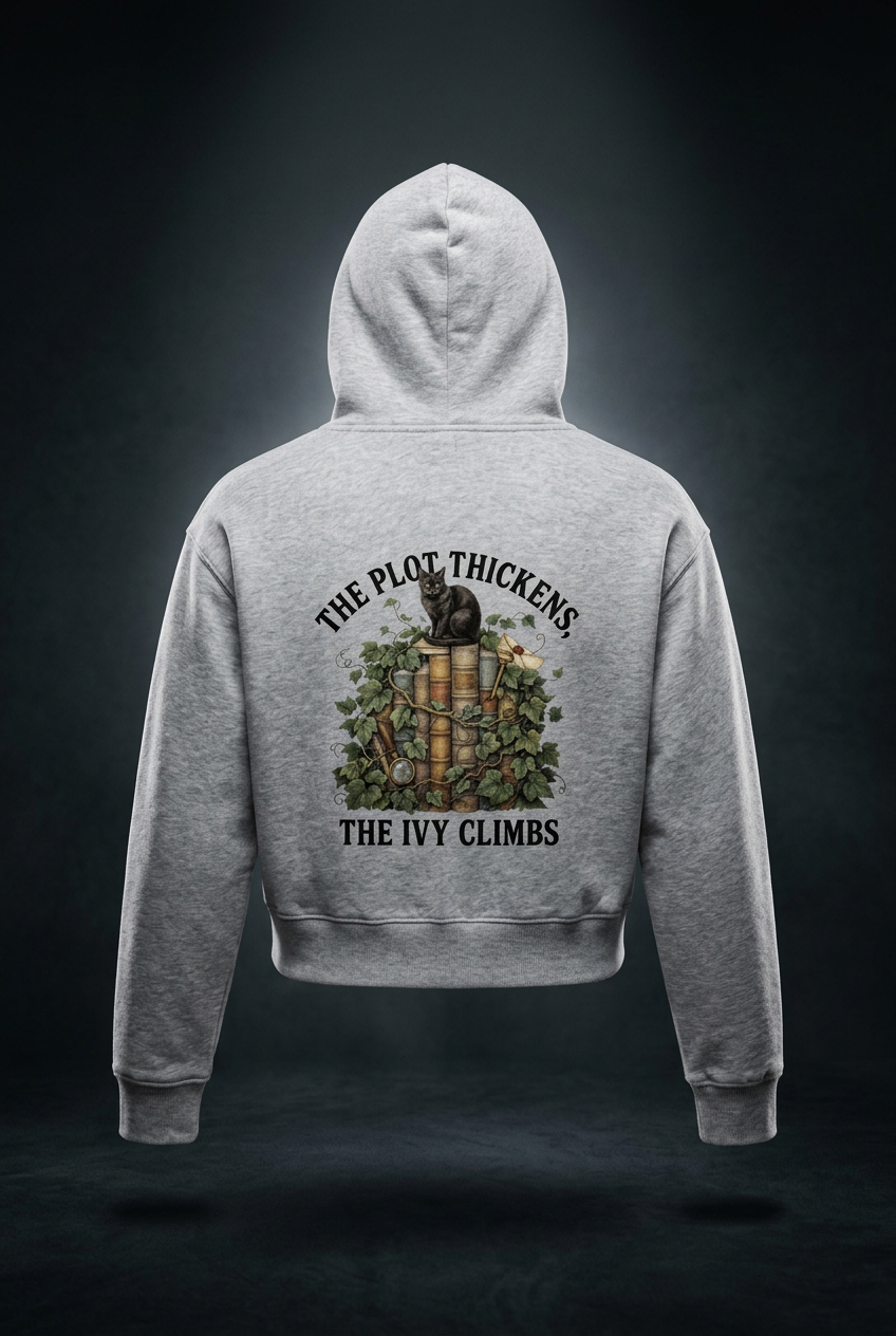 Women’s cropped drop-shoulder hoodie with a black cat on ivy-covered books, The Plot Thickens, The Ivy Climbs back print