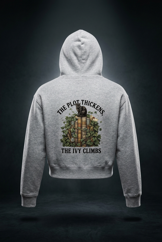 Women’s cropped drop-shoulder hoodie with a black cat on ivy-covered books, The Plot Thickens, The Ivy Climbs back print