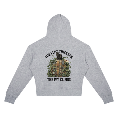 Women’s cropped drop-shoulder hoodie with a black cat on ivy-covered books, The Plot Thickens, The Ivy Climbs back print