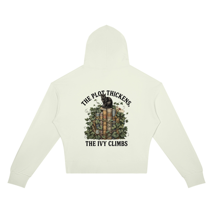 Women’s cropped drop-shoulder hoodie with a black cat on ivy-covered books, The Plot Thickens, The Ivy Climbs back print